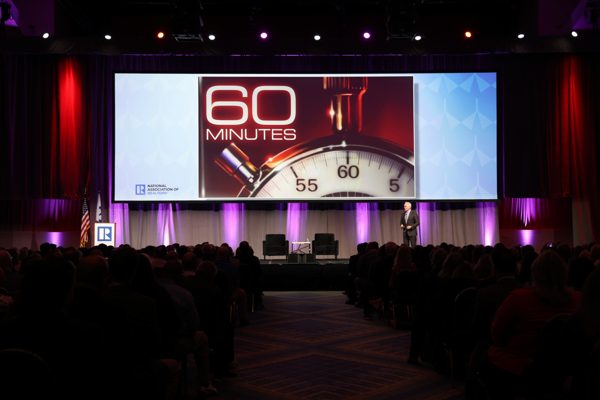 View of General Session stage with 60 Minutes image on screen for Scott Pelley: Truth Worth Telling